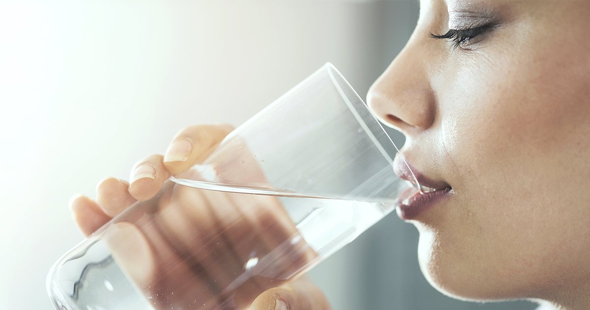 5 Reasons Why Liquid Zeolite is Better Woman drinking a glass of water